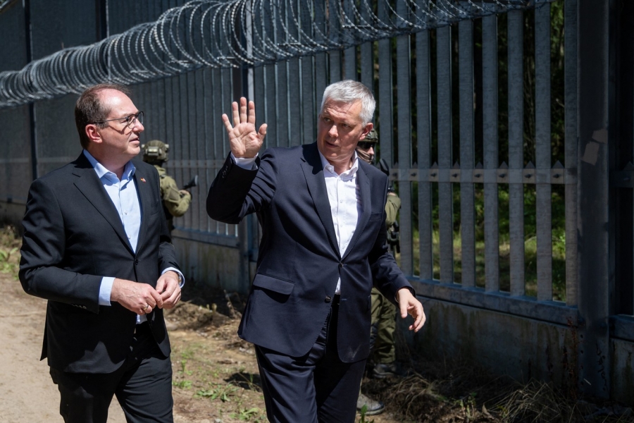 Tomasz Siemoniak (R) gestures as with his German counterpart Alexander Dobrindt